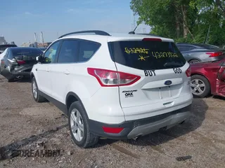 2014 Ford Escape SE with VIN 1FMCU9G92EUB32926, listed as a IAAI auction lot 42273922 with 172,193 mi miles and . Bid and sale history available at DreamBid. Image 3.