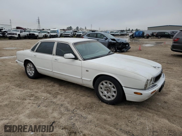 1998 Jaguar XJ with VIN SAJHX1248WC835728, listed as a Copart auction lot 86698244 with 116,768 mi miles and Clean title. Bid and sale history available at DreamBid. Image 4.