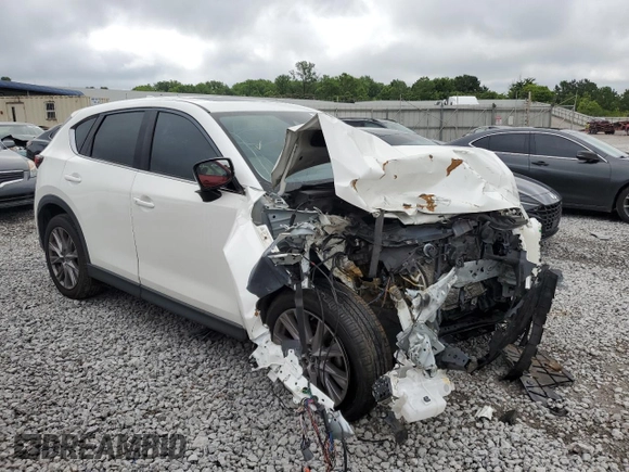 2019 Mazda CX-5 Grand Touring with VIN JM3KFADM6K1581261, listed as a Copart auction lot 59965175 with 127,837 mi miles and Salvage title. Bid and sale history available at DreamBid. Image 4.
