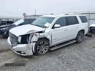 2019 GMC Yukon Denali with VIN 1GKS1CKJ7KR364240, listed as a IAAI auction lot 41645374 with 104,956 mi miles. Bid and sale history available at carsss.com. Image 2.
