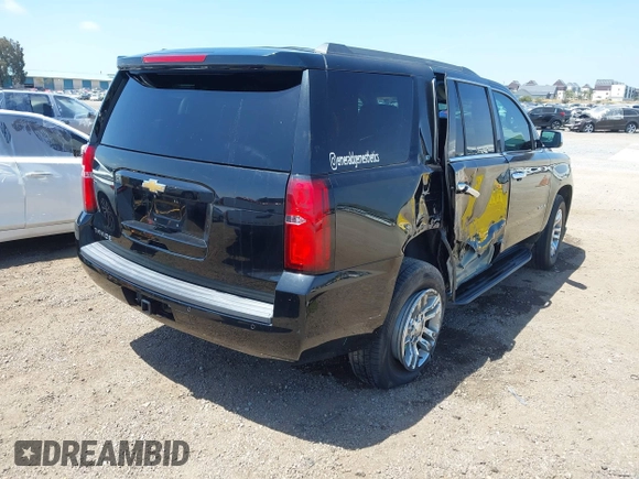 2015 Chevrolet Tahoe LT with VIN 1GNSCBKC8FR612607, listed as a IAAI auction lot 42099907 with 138,037 mi miles and . Bid and sale history available at DreamBid. Image 4.