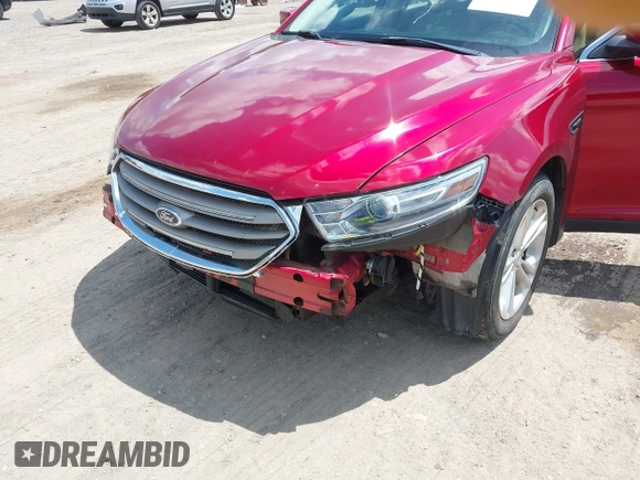 2014 Ford Taurus SEL z VIN 1FAHP2E89EG126922, wystawiony jako IAAI lot #42236235 z przebiegiem 176 917 mil mil oraz . Historia ofert i sprzedaży dostępna na DreamBid. Obrazek 13.