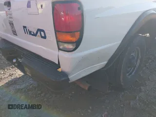 1999 Mazda B-Series 2WD Truck SX with VIN 4F4YR12C2XTM30361, listed as a IAAI auction lot 41439064 with 147,901 mi miles. Bid and sale history available at carsss.com. Image 6.