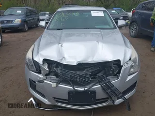 2014 Cadillac ATS Standard RWD z VIN 1G6AA5RA1E0177452, wystawiony jako IAAI lot #39138915 z przebiegiem 134 473 mil mil oraz . Historia ofert i sprzedaży dostępna na DreamBid. Obrazek 6.