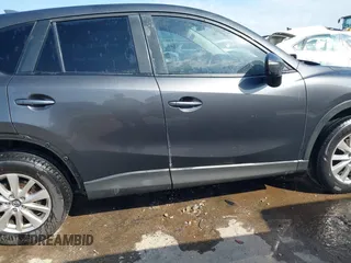 2016 Mazda CX-5 Touring with VIN JM3KE4CY3G0672977, listed as a IAAI auction lot 41889137 with 130,593 mi miles. Bid and sale history available at carsss.com. Image 14.