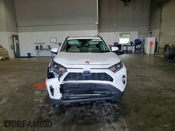 2019 Toyota RAV4 Hybrid XLE with VIN 2T3RWRFV1KW016526, listed as a Copart auction lot 61466435 with 64,255 mi miles and Salvage title. Bid and sale history available at DreamBid. Image 14.