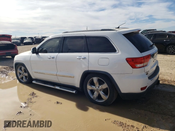 2013 Jeep Grand Cherokee Overland with VIN 1C4RJFCT2DC650336, listed as a Copart auction lot 83830304 with 129,858 mi miles and Clean Title. Bid and sale history available at carsss.com. Image 2.