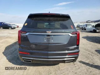 2021 Cadillac XT6 Premium Luxury z VIN 1GYKPCRS6MZ205831, wystawiony jako Copart lot #47259215 z przebiegiem 31 959 mil mil oraz Szkody całkowita. Historia ofert i sprzedaży dostępna na DreamBid. Obrazek 6.