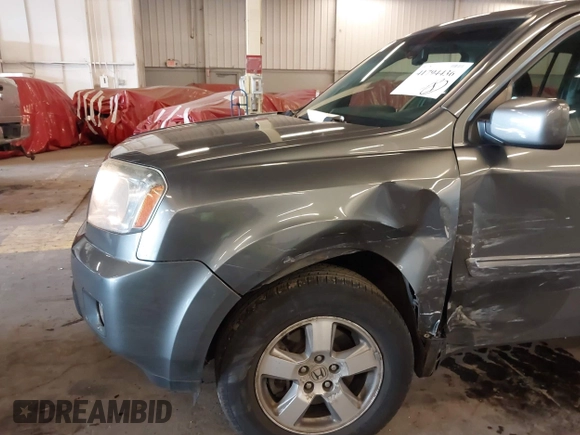 2011 Honda Pilot EX-L with VIN 5FNYF4H65BB020721, listed as a IAAI auction lot 41794436 with 113,630 mi miles and . Bid and sale history available at carsss.com. Image 17.