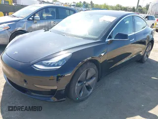 2018 Tesla Model 3 Long Range Battery with VIN 5YJ3E1EA7JF057031, listed as a IAAI auction lot 42139832 with 92,618 mi miles and . Bid and sale history available at DreamBid. Image 2.