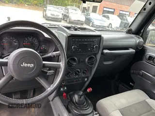 2008 Jeep Wrangler X with VIN 1J4FA24168L582227, listed as a Copart auction lot 58219065 with 98,284 mi miles and Salvage title. Bid and sale history available at DreamBid. Image 9.
