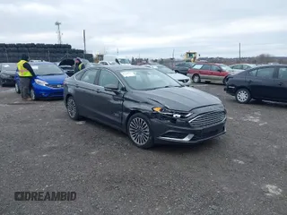 2018 Ford Fusion Energi SE with VIN 3FA6P0PU9JR144118, listed as a IAAI auction lot 41730927 with 140,937 mi miles. Bid and sale history available at carsss.com. Image 1.