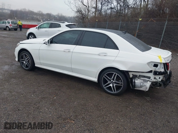 2014 Mercedes-Benz E 550 Sport with VIN WDDHF9BBXEA940995, listed as a IAAI auction lot 41872452 with 50,451 mi miles and . Bid and sale history available at DreamBid. Image 3.