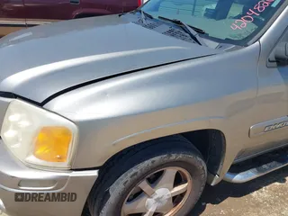 2003 GMC Envoy SLT with VIN 1GKDS13S732150215, listed as a IAAI auction lot 42048209 with 329,719 mi miles. Bid and sale history available at carsss.com. Image 6.