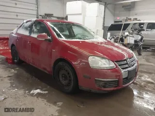 2008 Volkswagen Jetta Sedan Wolfsburg with VIN 3VWRJ71K38M137887, listed as a IAAI auction lot 41486256 with 105,998 mi miles. Bid and sale history available at carsss.com. Image 1.
