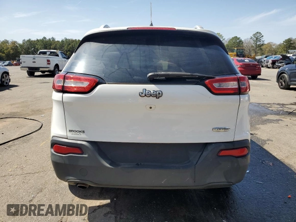 2016 Jeep Cherokee Altitude with VIN 1C4PJLCB9GW209643, listed as a Copart auction lot 47996565 with 167,005 mi miles and Salvage Title. Bid and sale history available at carsss.com. Image 6.