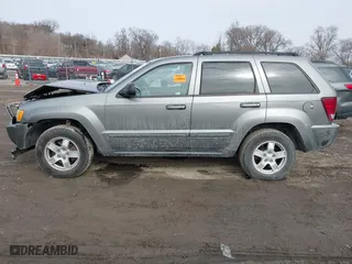 2007 Jeep Grand Cherokee Laredo with VIN 1J8GR48K57C556517, listed as a IAAI auction lot 41534166 with 158,914 mi miles. Bid and sale history available at carsss.com. Image 14.