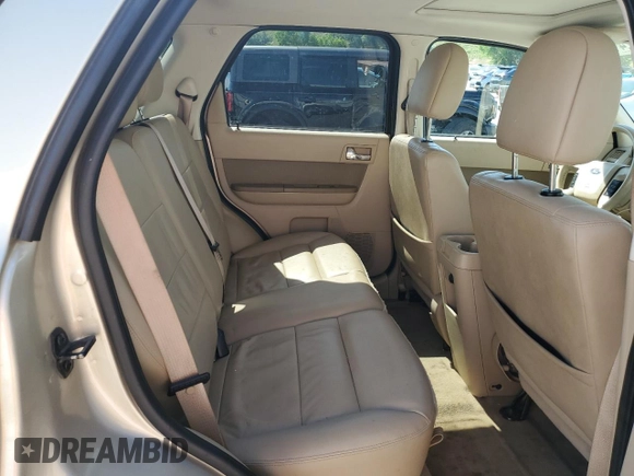 2010 Ford Escape Limited z VIN 1FMCU9EG5AKC49732, wystawiony jako Copart lot #61172415 z przebiegiem 148 796 mil mil oraz Szkoda całkowita • Salvage title. Historia ofert i sprzedaży dostępna na DreamBid. Obrazek 11.