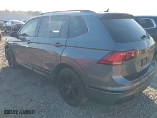2023 Volkswagen Tiguan SE R-Line Black with VIN 3VV8B7AX3PM014632, listed as a IAAI auction lot 41002858 with 40,955 mi miles. Bid and sale history available at carsss.com. Image 3.