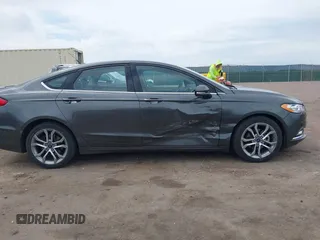 2017 Ford Fusion SE z VIN 3FA6P0H76HR354078, wystawiony jako IAAI lot #42103550 z przebiegiem 103 201 mil mil oraz . Historia ofert i sprzedaży dostępna na DreamBid. Obrazek 13.