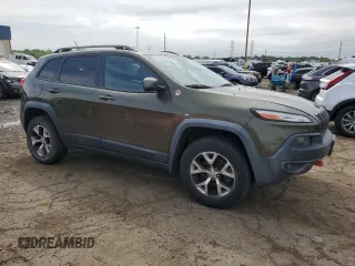 2015 Jeep Cherokee Trailhawk with VIN 1C4PJMBSXFW545534, listed as a Copart auction lot 62236885 with 148,448 mi miles and Clean title. Bid and sale history available at DreamBid. Image 4.