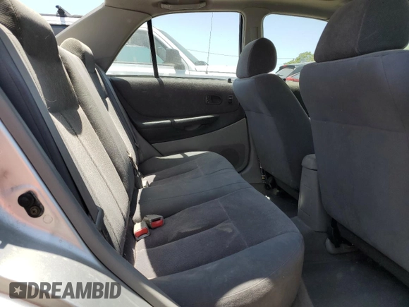 2002 Mazda Protege DX z VIN JM1BJ225920543960, wystawiony jako Copart lot #56336555 z przebiegiem 173 874 mil mil oraz Szkoda całkowita • Salvage title. Historia ofert i sprzedaży dostępna na DreamBid. Obrazek 10.