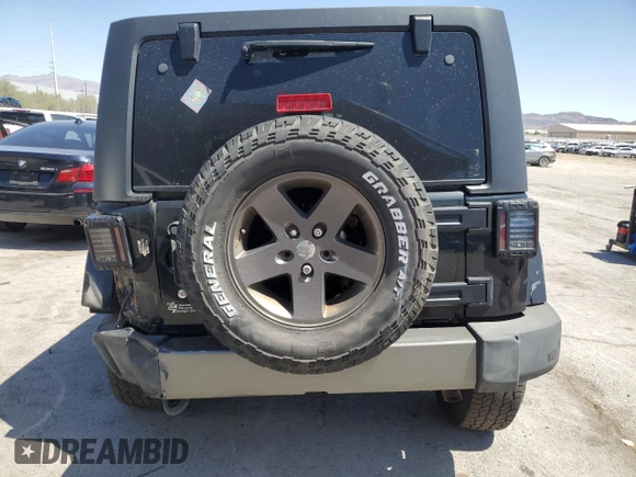 2015 Jeep Wrangler Unlimited Freedom with VIN 1C4HJWDG0FL598947, listed as a Copart auction lot 61794214 with 125,778 mi miles and Salvage title. Bid and sale history available at DreamBid. Image 6.