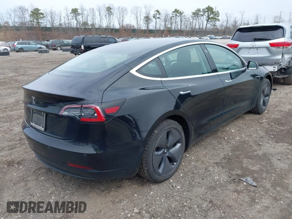 2019 Tesla Model 3 Mid Range with VIN 5YJ3E1EA2KF395549, listed as a IAAI auction lot 41895977 with 97,108 mi miles and . Bid and sale history available at carsss.com. Image 4.