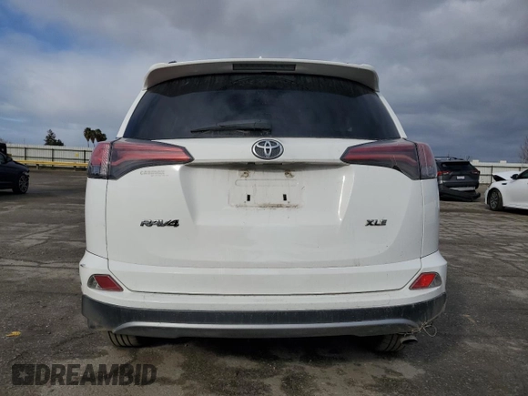 2018 Toyota RAV4 XLE with VIN 2T3WFREV1JW471752, listed as a Copart auction lot 46952565 with 87,705 mi miles and Salvage Title. Bid and sale history available at DreamBid. Image 6.