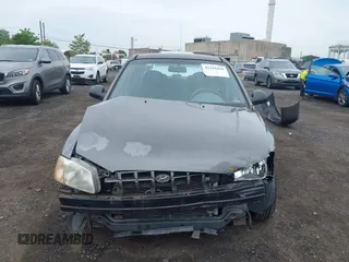 2002 Hyundai Accent GL z VIN KMHCG45C52U372587, wystawiony jako IAAI lot #42244428 z przebiegiem 43 538 mil mil oraz . Historia ofert i sprzedaży dostępna na DreamBid. Obrazek 12.