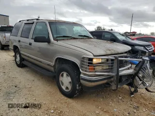 1999 GMC Yukon with VIN 1GKEK13R5XJ767903, listed as a Copart auction lot 84158844 with 112,229 mi miles and Salvage Title. Bid and sale history available at carsss.com. Image 4.