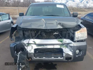 2014 Nissan Titan Pro-4X with VIN 1N6BA0EC3EN514358, listed as a IAAI auction lot 41636363 with 166,201 mi miles and . Bid and sale history available at DreamBid. Image 12.