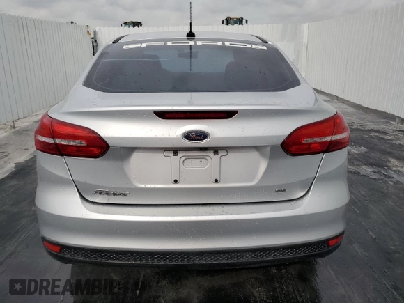 2018 Ford Focus SE z VIN 1FADP3F29JL272804, wystawiony jako Copart lot #49612625 z przebiegiem Nie podano mil oraz Czysty tytuł • Clean title. Historia ofert i sprzedaży dostępna na DreamBid. Obrazek 6.
