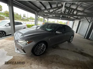 2021 Genesis G70 2.0T z VIN KMTG34LAXMU074866, wystawiony jako Copart lot #56966995 z przebiegiem 54 000 mil mil oraz Tytuł czysty. Historia ofert i sprzedaży dostępna na DreamBid. Obrazek 2.