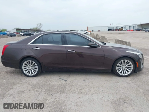 2016 Cadillac CTS Luxury Collection RWD z VIN 1G6AR5SX7G0111806, wystawiony jako IAAI lot #41908192 z przebiegiem 86 309 mil mil oraz . Historia ofert i sprzedaży dostępna na DreamBid. Obrazek 13.
