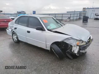 2002 Hyundai Accent GL with VIN KMHCG45C02U301443, listed as a Copart auction lot 80670164 with 124,163 mi miles and Salvage Title. Bid and sale history available at carsss.com. Image 4.