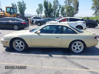 1995 Nissan 240SX z VIN JN1AS44D3SW013539, wystawiony jako IAAI lot #42291213 z przebiegiem 198 479 mil mil oraz . Historia ofert i sprzedaży dostępna na DreamBid. Obrazek 14.