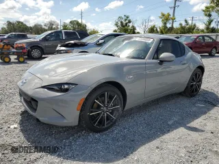 2024 Mazda MX-5 Miata Grand Touring z VIN JM1NDAM70R0601686, wystawiony jako Copart lot #60688085 z przebiegiem 1 732 mil mil oraz Szkoda całkowita • Salvage title. Historia ofert i sprzedaży dostępna na DreamBid. Obrazek 1.