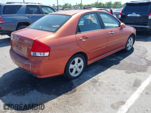 2009 Kia Spectra EX with VIN KNAFE221195026956, listed as a IAAI auction lot 42019309 with 121,341 mi miles. Bid and sale history available at carsss.com. Image 4.