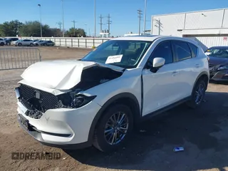 2019 Mazda CX-5 Touring with VIN JM3KFACM4K1668352, listed as a IAAI auction lot 41481291 with 65,901 mi miles and . Bid and sale history available at carsss.com. Image 17.