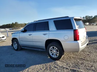 2015 Chevrolet Tahoe LS with VIN 1GNSCAKC1FR643336, listed as a Copart auction lot 47523105 with 113,656 mi miles and Salvage title. Bid and sale history available at DreamBid. Image 2.