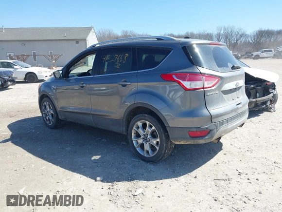 2014 Ford Escape Titanium with VIN 1FMCU9J93EUC72752, listed as a IAAI auction lot 41827668 with 91,194 mi miles and . Bid and sale history available at DreamBid. Image 3.