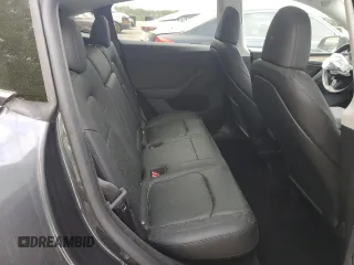 2024 Tesla Model Y Long Range z VIN 7SAYGDEE9RA293776, wystawiony jako Copart lot #51289225 z przebiegiem 12 990 mil mil oraz Szkoda całkowita • Salvage title. Historia ofert i sprzedaży dostępna na DreamBid. Obrazek 10.