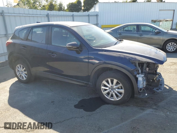 2015 Mazda CX-5 Sport with VIN JM3KE2BEXF0483141, listed as a Copart auction lot 59134105 with 71,727 mi miles and Salvage title. Bid and sale history available at DreamBid. Image 4.