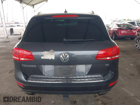 2014 Volkswagen Touareg Sport with VIN WVGEF9BP0ED015273, listed as a IAAI auction lot 42046823 with 84,694 mi miles and . Bid and sale history available at DreamBid. Image 16.