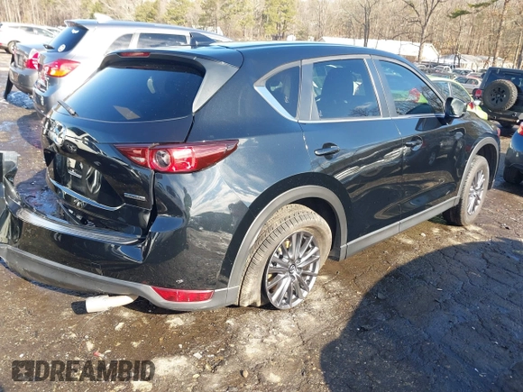 2021 Mazda CX-5 Touring with VIN JM3KFBCM9M0483082, listed as a IAAI auction lot 41305127 with 42,926 mi miles. Bid and sale history available at carsss.com. Image 4.