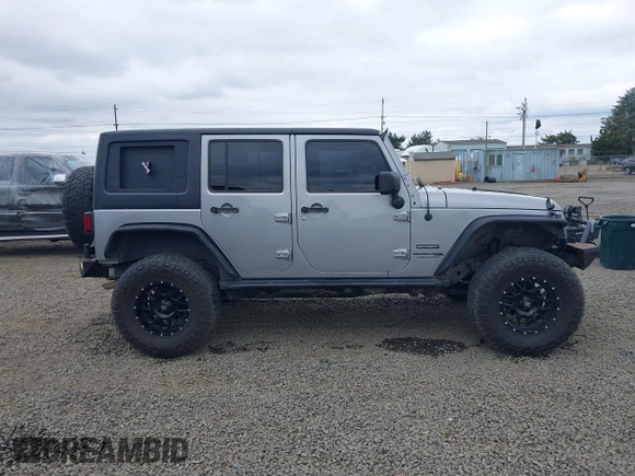 2018 Jeep Wrangler Unlimited Sport S with VIN 1C4BJWDG4JL861052, listed as a IAAI auction lot 42100517 with 43,907 mi miles and . Bid and sale history available at DreamBid. Image 14.