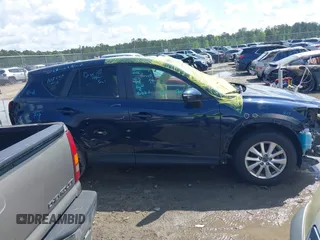 2016 Mazda CX-5 Touring with VIN JM3KE4CY0G0916908, listed as a IAAI auction lot 41848823 with 53,255 mi miles. Bid and sale history available at carsss.com. Image 13.