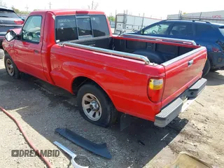 2002 Mazda B-Series Truck SX with VIN 4F4YR12D02TM01264, listed as a IAAI auction lot 41908459 with 205,445 mi miles and . Bid and sale history available at DreamBid. Image 3.