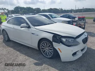 2013 BMW 6 Series 650i xDrive z VIN WBAYM1C58DDZ02668, wystawiony jako IAAI lot #41986512 z przebiegiem 77 302 mil mil oraz . Historia ofert i sprzedaży dostępna na DreamBid. Obrazek 1.
